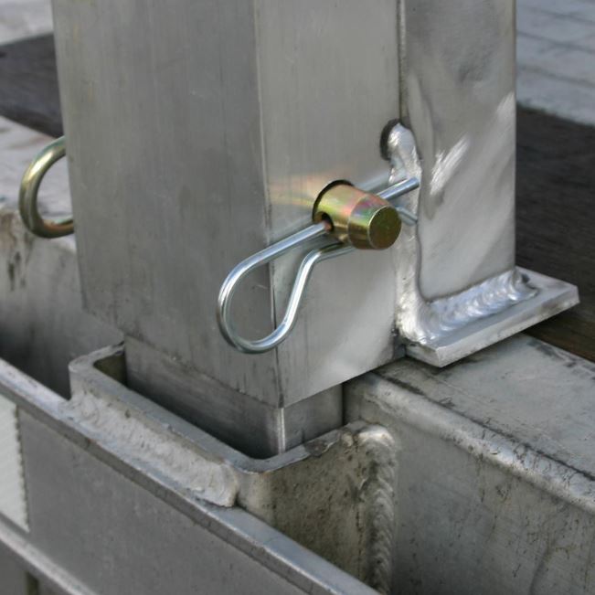 Aluminum load leveler measuring 5 inches long, 100-7/8 inches wide, and 20 inches high; 20,000-pound capacity, adjustable stake pocket post, suitable for 20-inch drop step deck trailers.