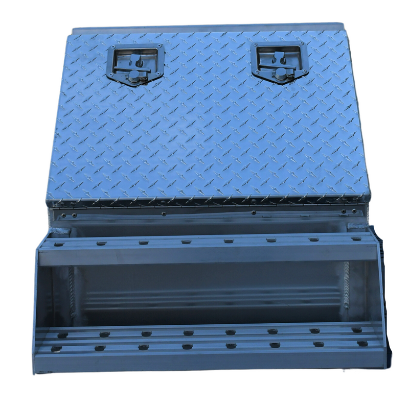 Durable aluminum step box measuring 23 inches deep, 28 inches high, and 24 inches wide, weighing 51 pounds. Equipped with welded steps featuring punched plates, T-lock with nylon roller, and rubber weather seal. Mounting brackets sold separately.