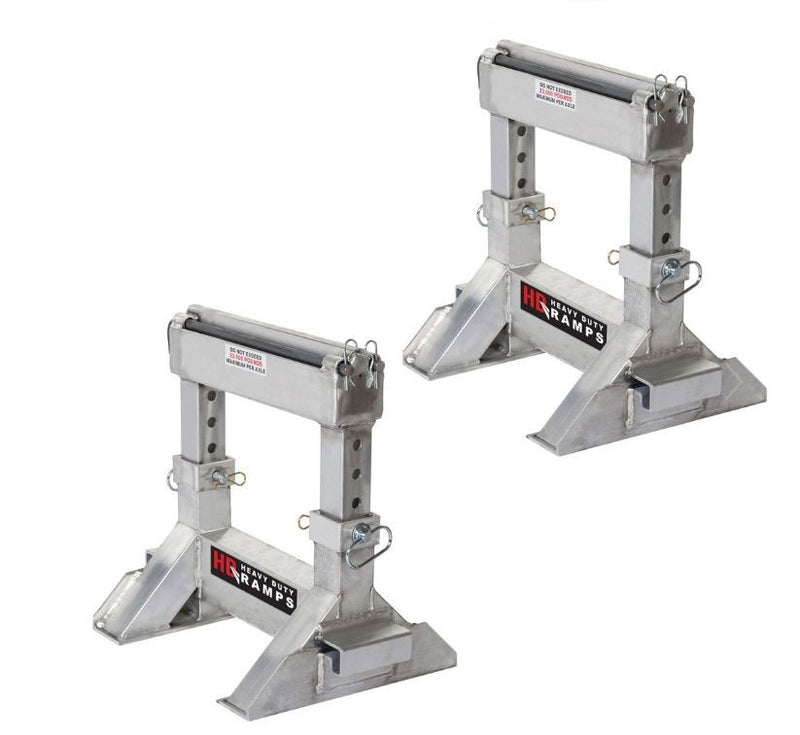 Pair of high-strength aluminum ramp stands measuring 2' 1.5" long and 18" wide; adjustable height from 18" to 24", 42 lbs per piece. Designed to support pin-on end ramps with a 10,000 lbs per axle capacity